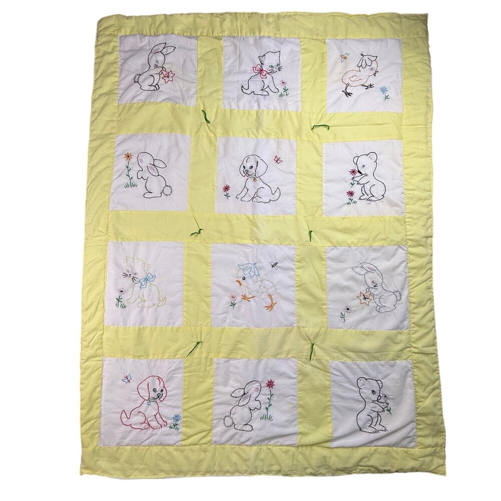 Vintage embroidered crib quilt